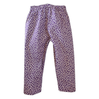 creamy flowers on purple . peasy pants